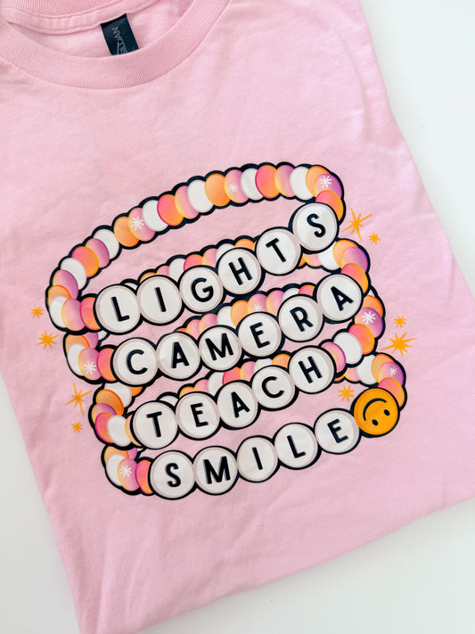 Lights Camera Teach Smile Tee